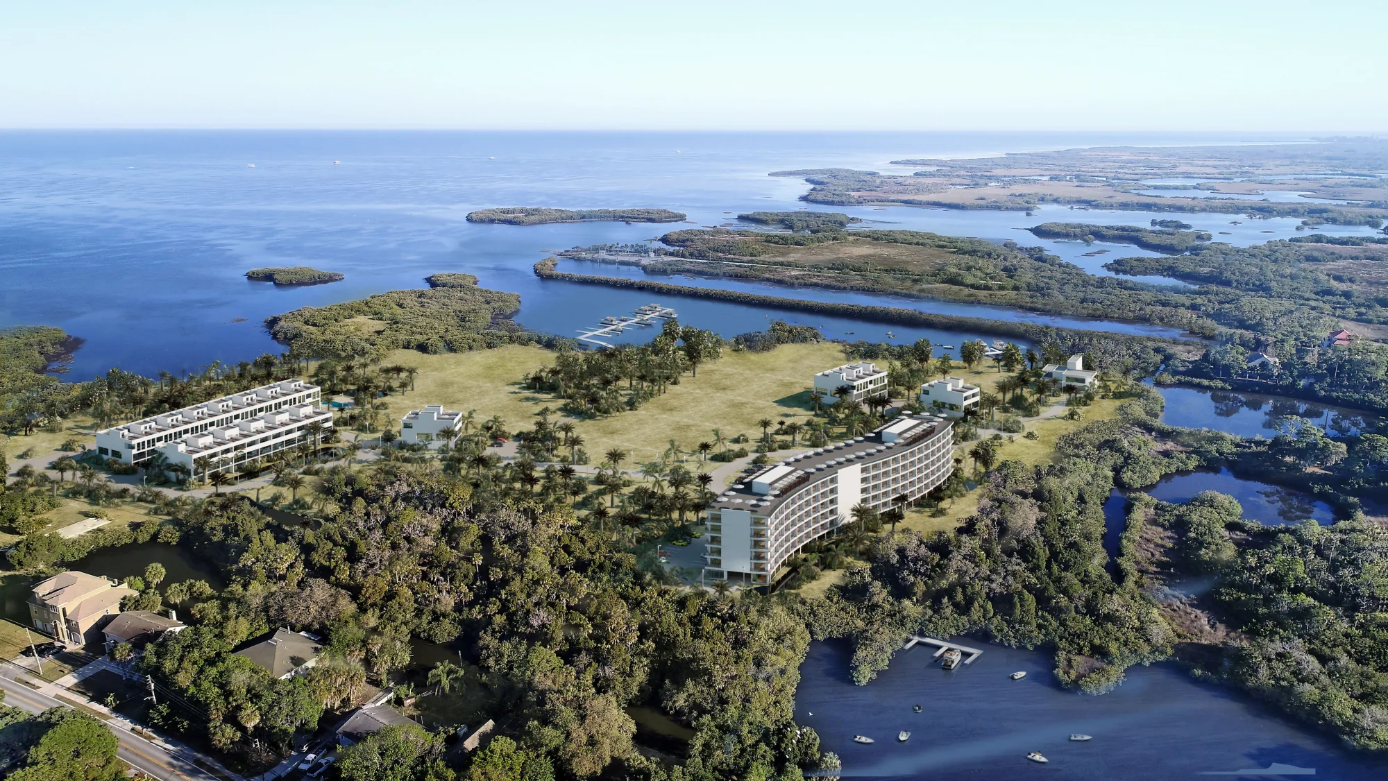 Aerial rendering of a coastal development read against its shoreline, USA