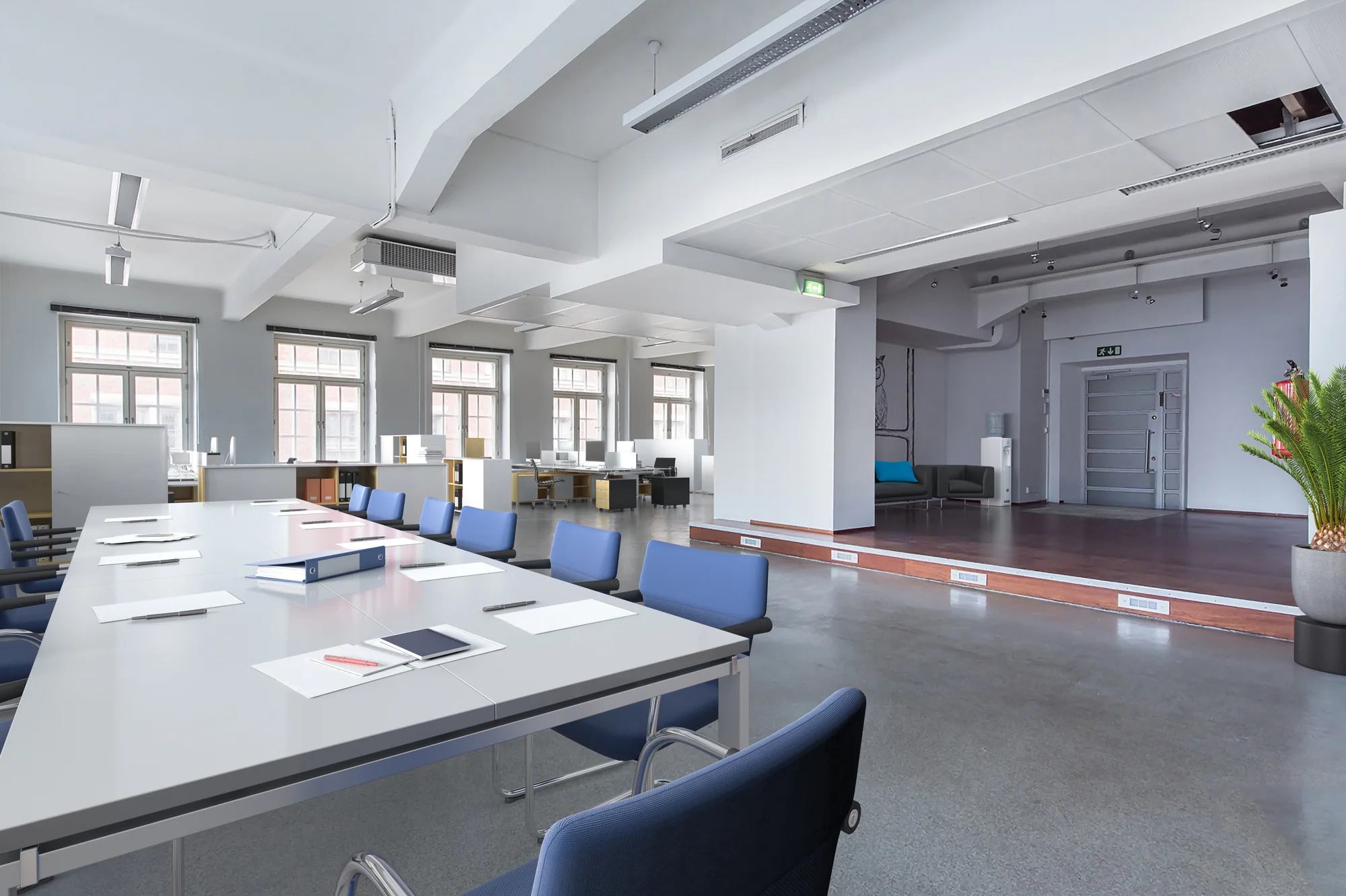 The same office break room in Finland, staged with new furniture and finishes